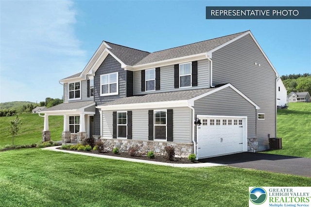 2010 Settlers Ridge Rd Lot 4, North Whitehall Twp, PA 18080 - view of front of property featuring driveway, a front yard, stone siding, and a shingled roof