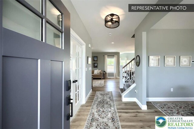 2010 Settlers Ridge Rd Lot 4, North Whitehall Twp, PA 18080 - entryway featuring stairs, light wood-type flooring, and french doors