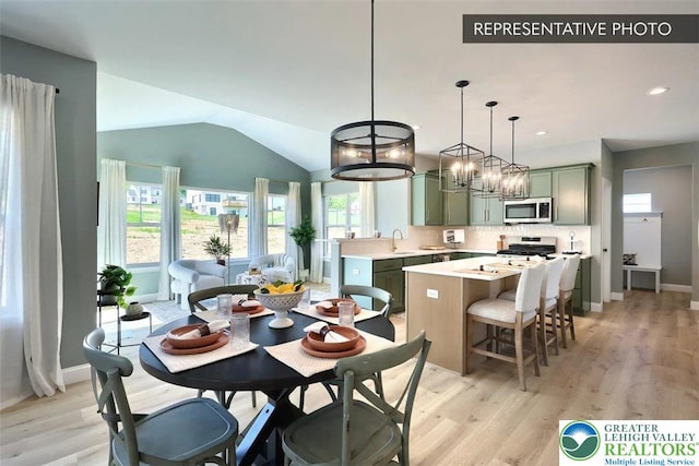 2010 Settlers Ridge Rd Lot 4, North Whitehall Twp, PA 18080 - dining room with healthy amount of natural light, light wood finished floors, lofted ceiling, recessed lighting, and a chandelier