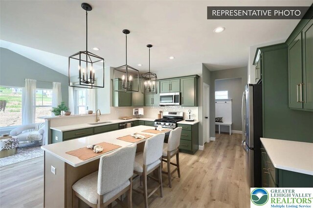 2010 Settlers Ridge Rd Lot 4, North Whitehall Twp, PA 18080 - kitchen featuring green cabinets, stainless steel appliances, plenty of natural light, a breakfast bar area, and recessed lighting