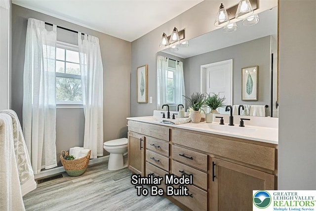 2010 Settlers Ridge Rd Lot 4, North Whitehall Twp, PA 18080 - bathroom featuring double vanity and wood finished floors