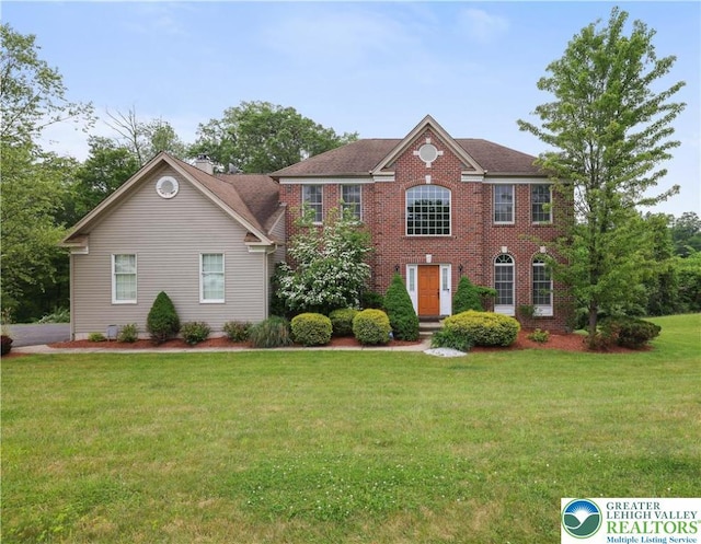 638 Stratton Dr, Middle Smithfield Twp, PA 18302 - colonial home with a front lawn and brick siding