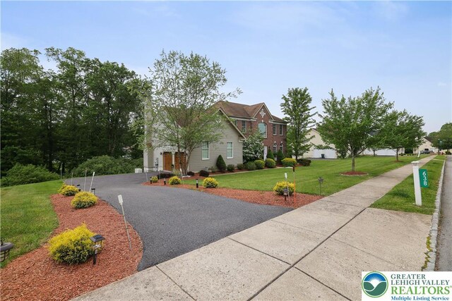 638 Stratton Dr, Middle Smithfield Twp, PA 18302 - view of side of home featuring a lawn