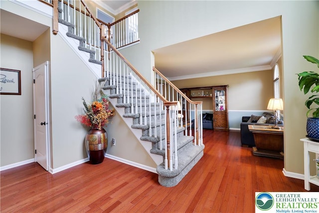 638 Stratton Dr, Middle Smithfield Twp, PA 18302 - staircase with wood finished floors and ornamental molding
