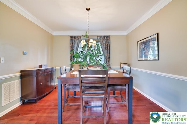 638 Stratton Dr, Middle Smithfield Twp, PA 18302 - dining space with a chandelier, crown molding, and wood finished floors