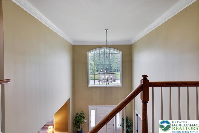 638 Stratton Dr, Middle Smithfield Twp, PA 18302 - stairway featuring a chandelier and ornamental molding
