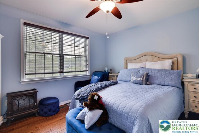 638 Stratton Dr, Middle Smithfield Twp, PA 18302 - bedroom featuring multiple windows, wood finished floors, and ceiling fan