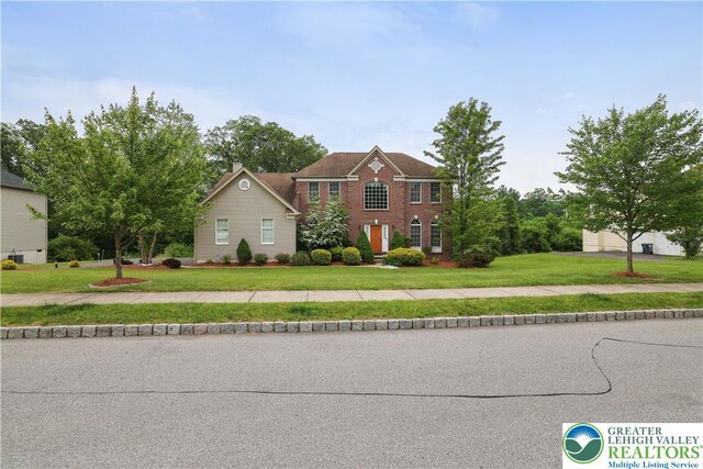 638 Stratton Dr, Middle Smithfield Twp, PA 18302 - colonial-style house with a front lawn and brick siding