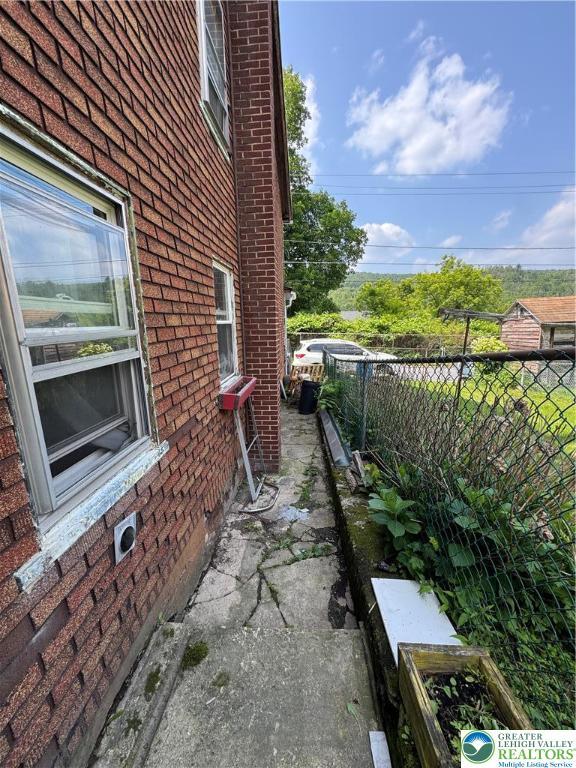 226 E Snyder Ave, Lansford Boro, PA 18232 - view of property exterior featuring brick siding