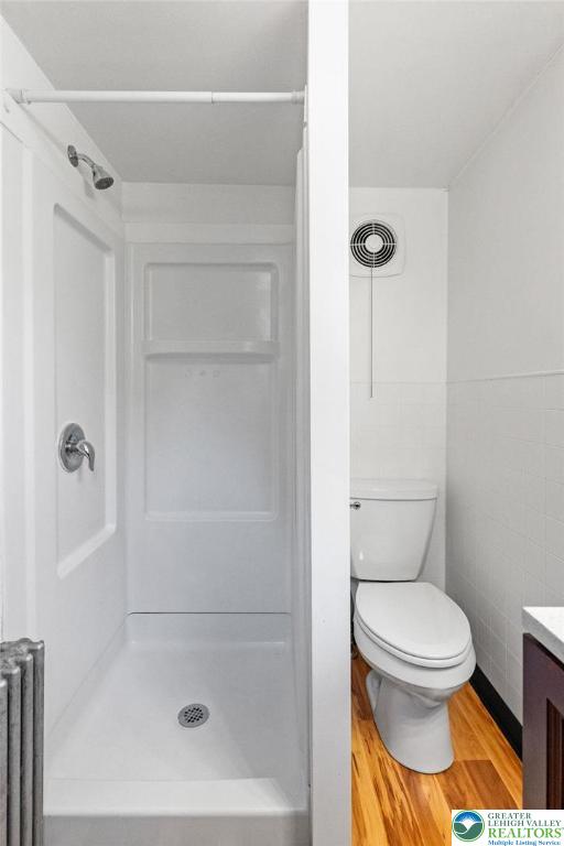 100 E Mahoning Dr, Mahoning Twp, PA 18235 - bathroom featuring wood finished floors, a shower, and vanity