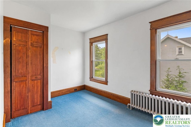 100 E Mahoning Dr, Mahoning Twp, PA 18235 - unfurnished bedroom featuring radiator heating unit, carpet floors, and a closet