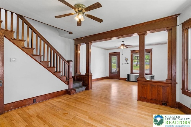 100 E Mahoning Dr, Mahoning Twp, PA 18235 - foyer featuring ceiling fan, radiator heating unit, light wood-style flooring, ornate columns, and crown molding