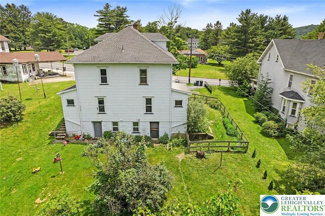 100 E Mahoning Dr, Mahoning Twp, PA 18235 - rear view of house with a chimney, stairway, and roof with shingles