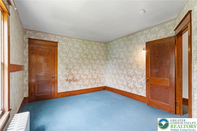 100 E Mahoning Dr, Mahoning Twp, PA 18235 - spare room featuring wallpapered walls, carpet floors, a smoke detector, and radiator