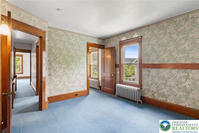100 E Mahoning Dr, Mahoning Twp, PA 18235 - carpeted empty room featuring radiator heating unit, wallpapered walls, and a smoke detector