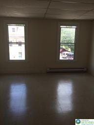 526 W Gordon St Unit 1, Allentown City, PA 18102 - empty room featuring baseboard heating and a drop ceiling