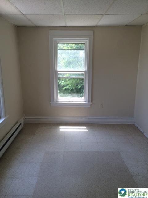 526 W Gordon St Unit 1, Allentown City, PA 18102 - spare room featuring a drop ceiling, a baseboard heating unit, and light floors