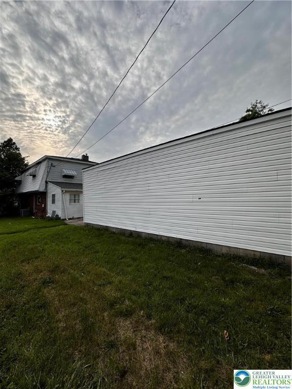 701 N Lacrosse St, Allentown City, PA 18109 - view of side of home with a lawn