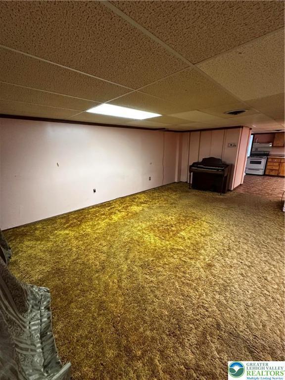 701 N Lacrosse St, Allentown City, PA 18109 - unfurnished living room with a paneled ceiling and carpet flooring