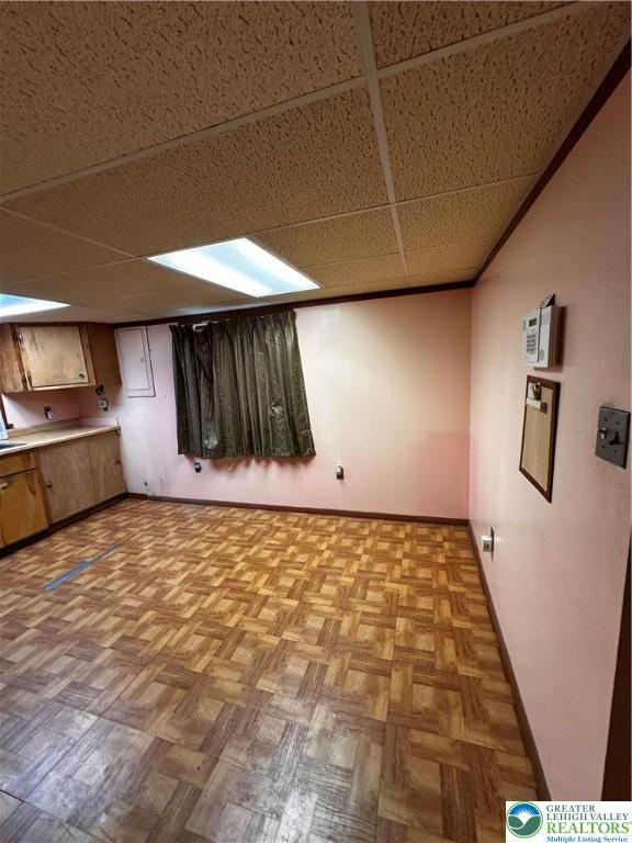 701 N Lacrosse St, Allentown City, PA 18109 - finished basement featuring a drop ceiling and baseboards
