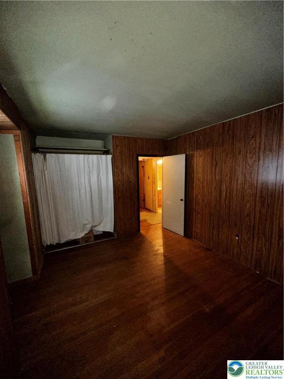 701 N Lacrosse St, Allentown City, PA 18109 - spare room with wood finished floors and wooden walls