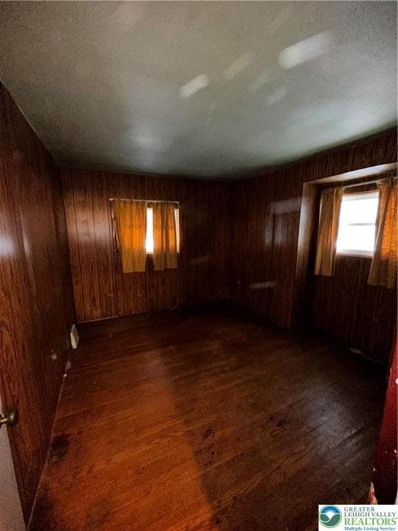 701 N Lacrosse St, Allentown City, PA 18109 - empty room with wood walls and dark wood finished floors