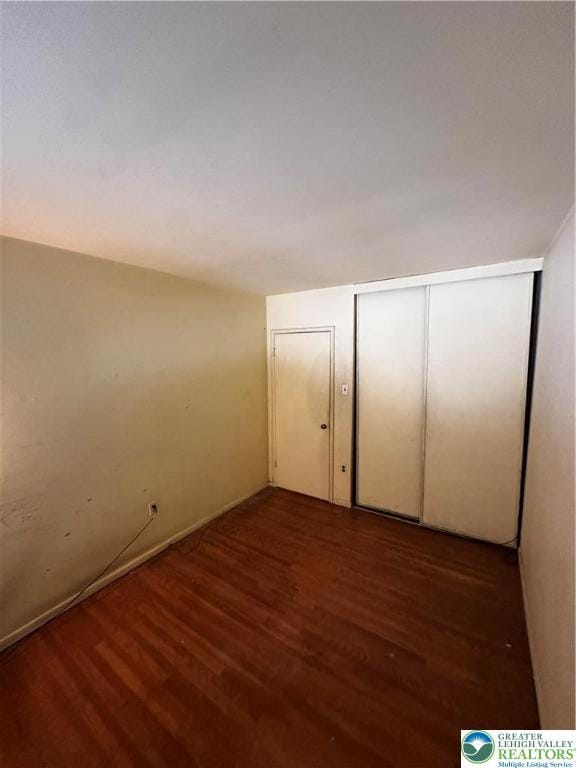 701 N Lacrosse St, Allentown City, PA 18109 - unfurnished bedroom with wood finished floors and a closet