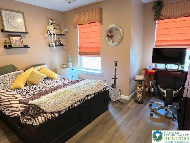 4549 Woodbrush Way, Upper Macungie Twp, PA 18104 - bedroom with wood finished floors and an office area