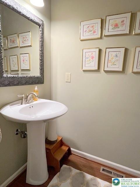 4549 Woodbrush Way, Upper Macungie Twp, PA 18104 - bathroom featuring baseboards and wood finished floors