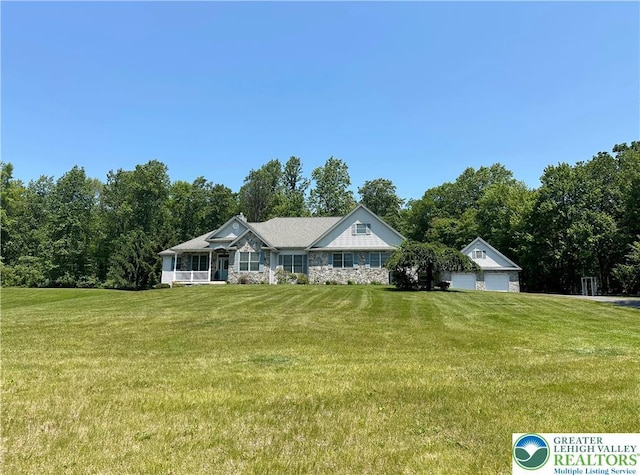 1437 Nectarine Rd, Lehigh Twp, PA 18038 - view of front of house featuring a front yard, a garage, and stone siding