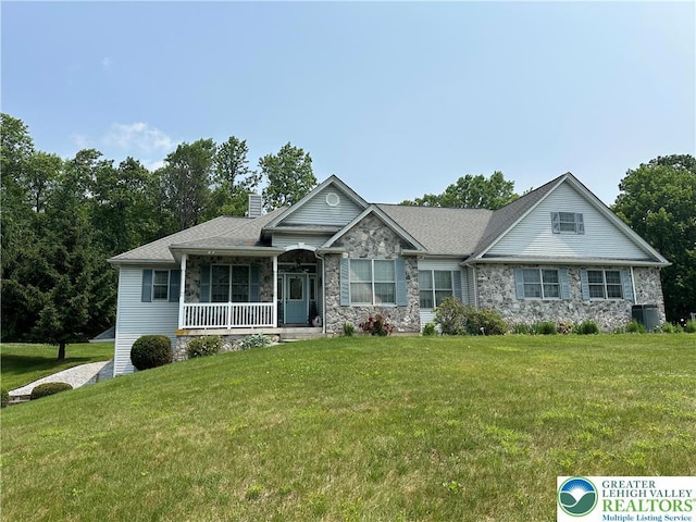1437 Nectarine Rd, Lehigh Twp, PA 18038 - view of front of house with stone siding, covered porch, and a front yard