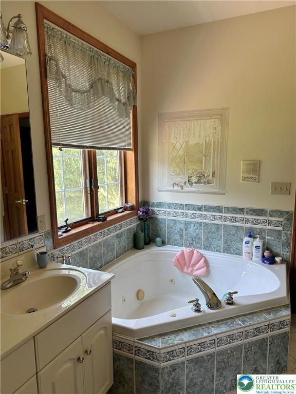 1437 Nectarine Rd, Lehigh Twp, PA 18038 - bathroom with vanity and a tub with jets