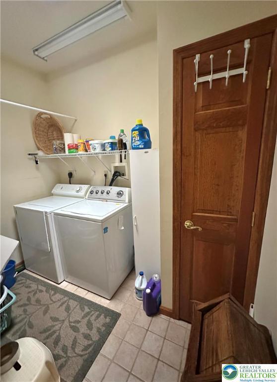 1437 Nectarine Rd, Lehigh Twp, PA 18038 - laundry room featuring separate washer and dryer and light tile patterned flooring