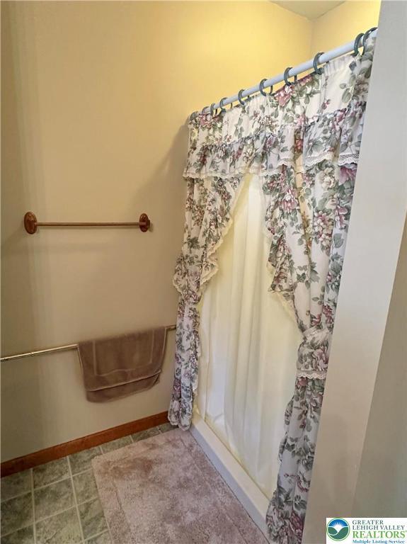 1437 Nectarine Rd, Lehigh Twp, PA 18038 - full bathroom with baseboards and a shower with shower curtain