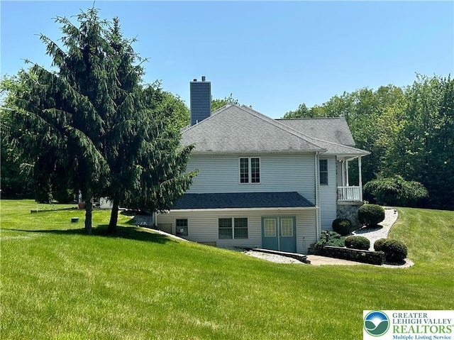 1437 Nectarine Rd, Lehigh Twp, PA 18038 - rear view of house with a lawn, a chimney, and a shingled roof