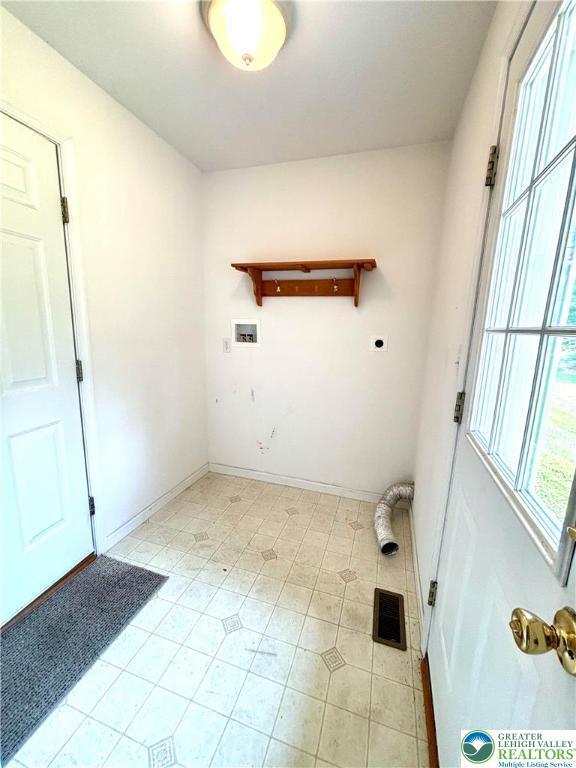 538 Carney Rd, Polk Twp, PA 18071 - laundry room featuring hookup for an electric dryer, washer hookup, and light tile patterned floors