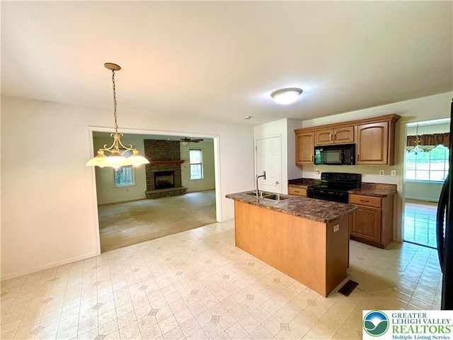 538 Carney Rd, Polk Twp, PA 18071 - kitchen featuring black appliances, healthy amount of natural light, open floor plan, and a kitchen island with sink