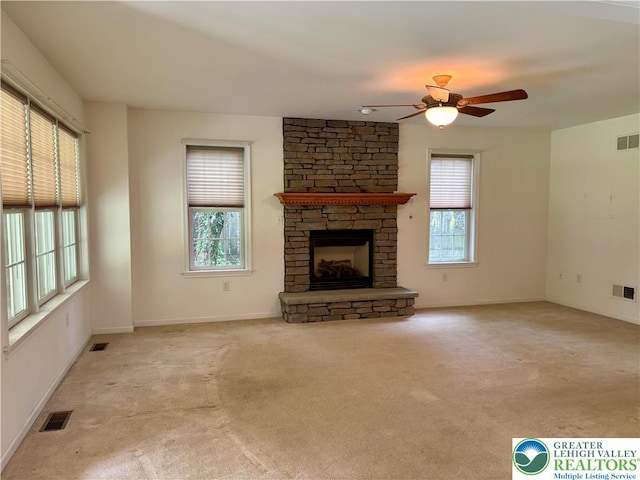 538 Carney Rd, Polk Twp, PA 18071 - unfurnished living room with carpet flooring, a ceiling fan, and a fireplace