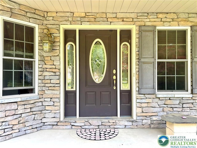 538 Carney Rd, Polk Twp, PA 18071 - doorway to property with stone siding and covered porch