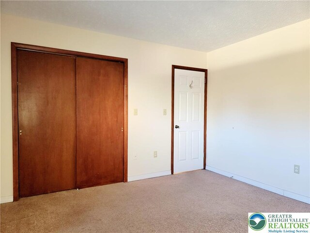 115 Foxfire Unit 306, Mount Pocono Boro, PA 18334 - unfurnished bedroom with carpet and a closet