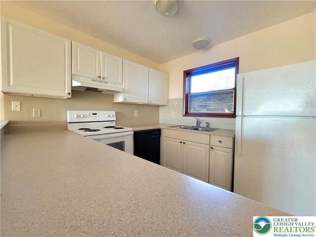 115 Foxfire Unit 306, Mount Pocono Boro, PA 18334 - kitchen featuring white appliances, under cabinet range hood, white cabinetry, light countertops, and a textured ceiling