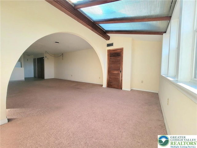 115 Foxfire Unit 306, Mount Pocono Boro, PA 18334 - carpeted empty room with arched walkways and baseboards