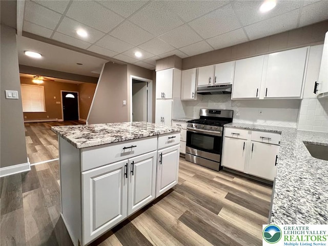 820 Ridge St, West Easton Borough, PA 18042 - kitchen featuring stainless steel gas range, under cabinet range hood, white cabinetry, recessed lighting, and a paneled ceiling