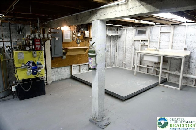 820 Ridge St, West Easton Borough, PA 18042 - unfinished below grade area featuring electric panel, a workshop area, and a heating unit