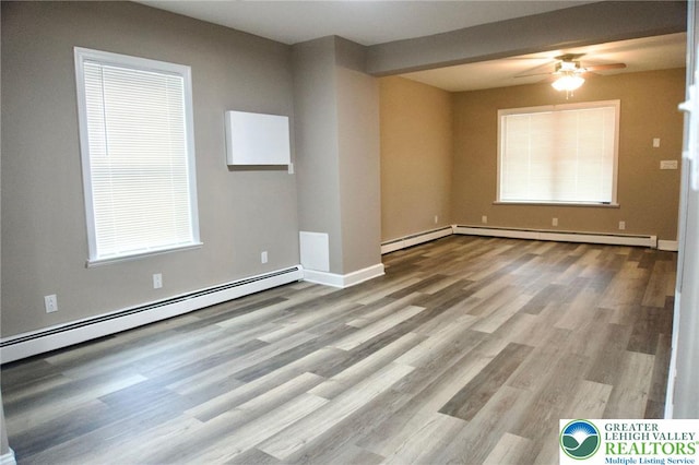 820 Ridge St, West Easton Borough, PA 18042 - unfurnished room featuring a baseboard heating unit, a ceiling fan, and wood finished floors
