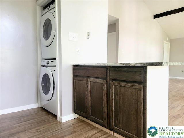 6522 Runnymead, Coolbaugh Twp, PA 18466 - laundry room with stacked washer / dryer and light wood-style flooring