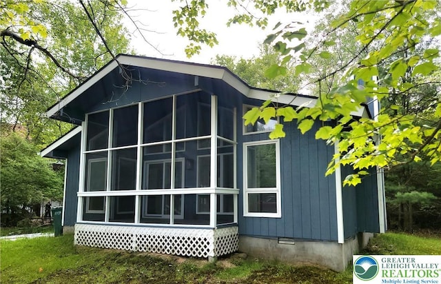 6522 Runnymead, Coolbaugh Twp, PA 18466 - view of side of property with a sunroom and crawl space