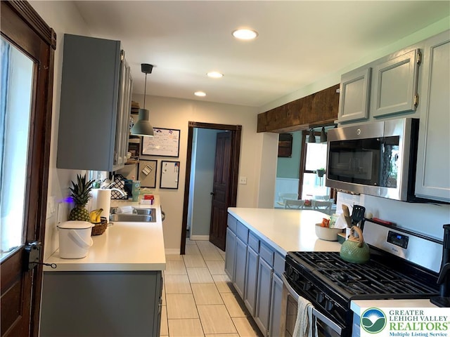 665 Walnut St, Emmaus Borough, PA 18049 - kitchen featuring stainless steel appliances, light countertops, recessed lighting, and light tile patterned floors