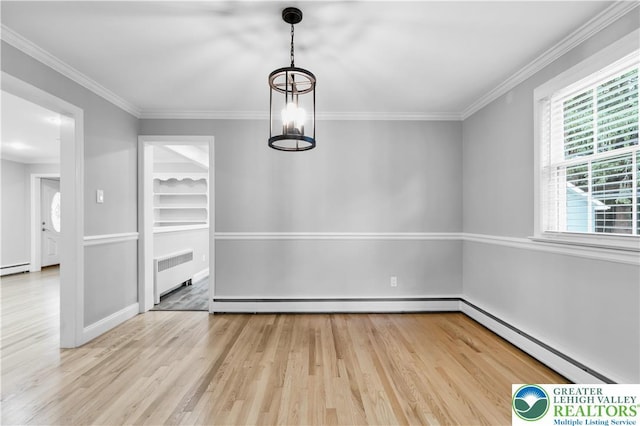 3032 W Woodlawn St, South Whitehall Twp, PA 18104 - unfurnished dining area featuring radiator, baseboard heating, light wood-style flooring, and crown molding