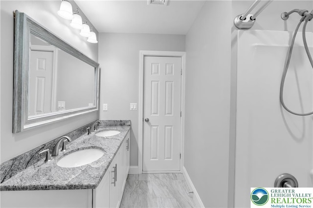 3032 W Woodlawn St, South Whitehall Twp, PA 18104 - bathroom with marble finish flooring and double vanity